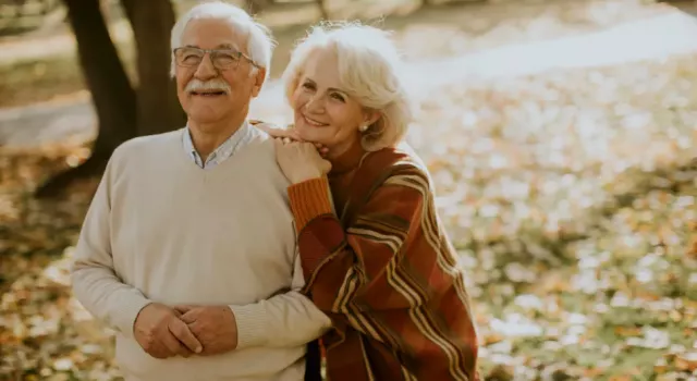 Elderly Couple Walking Down the Street